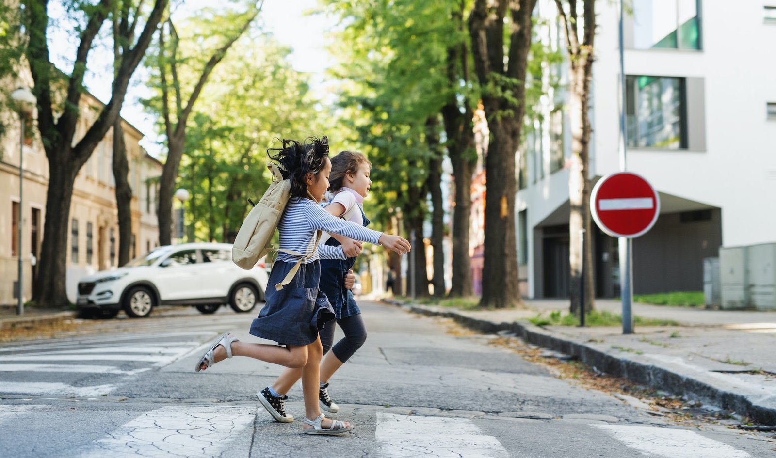 School children crossing a street in a small town